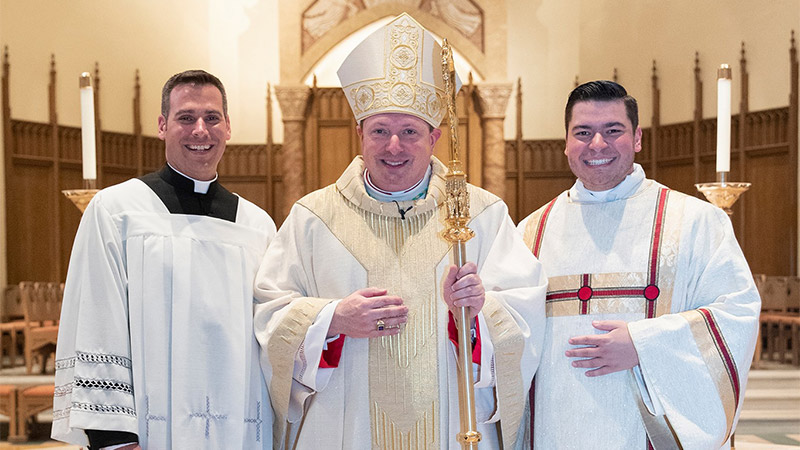 Indoor image of three priests